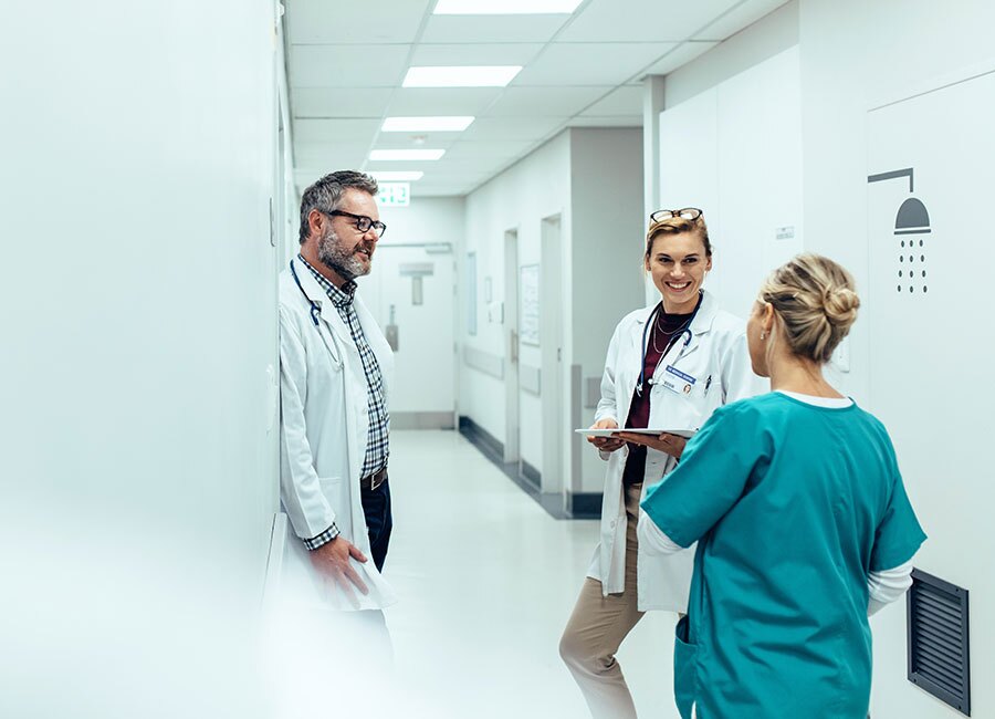 Doctors having a discussion in the hallway.